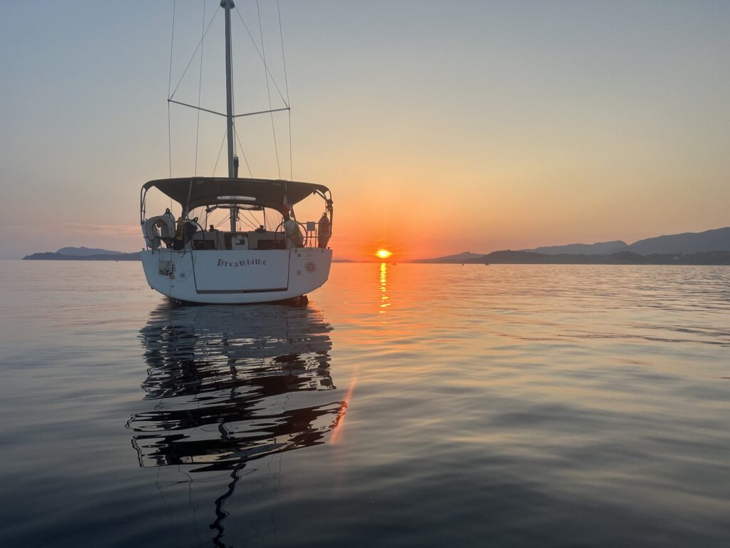 a yacht at sunset 